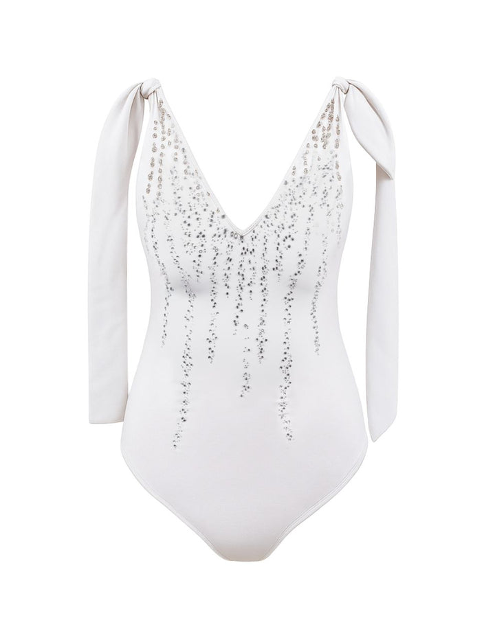 White swimsuit with sequin details on a white background